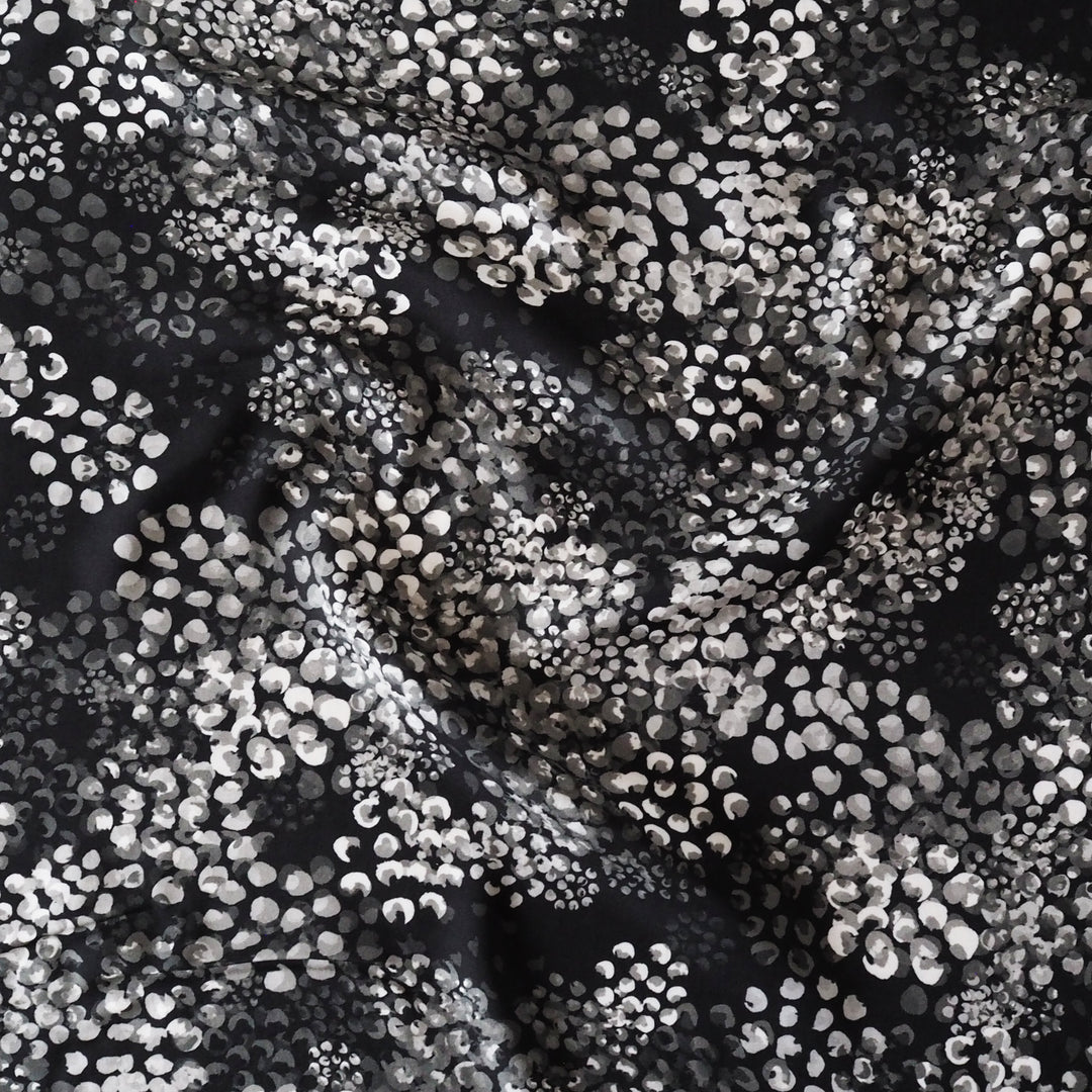 Monochrome Chicacheetah viscose twill sateen fabric featuring a black and white animal-inspired print, exclusive to Guthrie & Ghani.