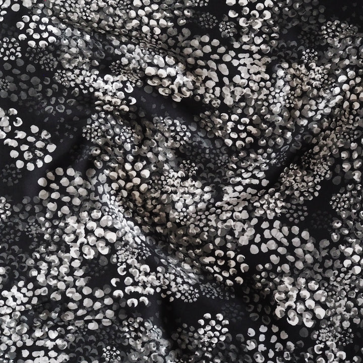 Monochrome Chicacheetah viscose twill sateen fabric featuring a black and white animal-inspired print, exclusive to Guthrie & Ghani.