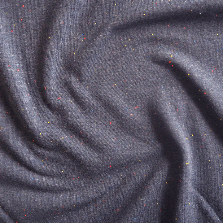 Denim blue fleeceback sweatshirt fabric with colourful flecks.