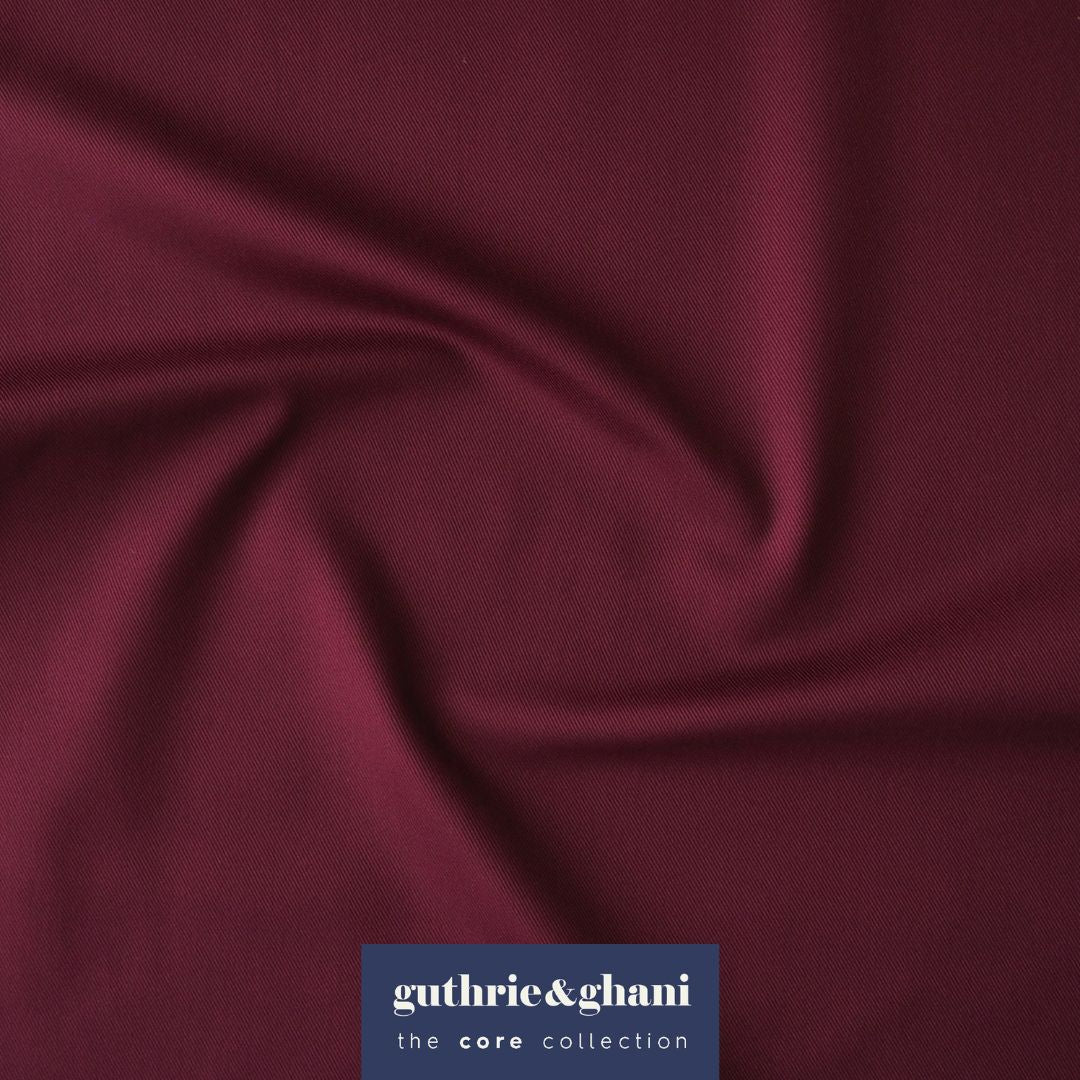 Burgundy fabric with Guthrie & Ghani logo in the corner
