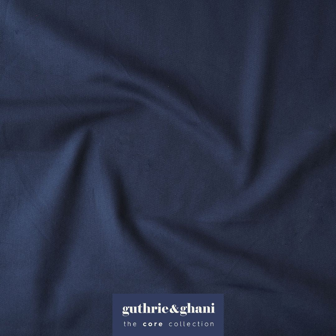 Navy blue fabric with 'guthrie & ghani' label in the corner
