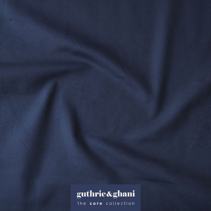 Navy blue fabric with 'guthrie & ghani' label in the corner