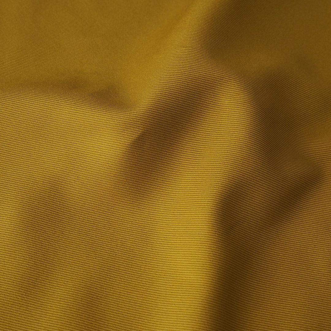 Sevenberry ochre yellow cotton twill drill fabric, perfect for dressmaking and other sewing projects.