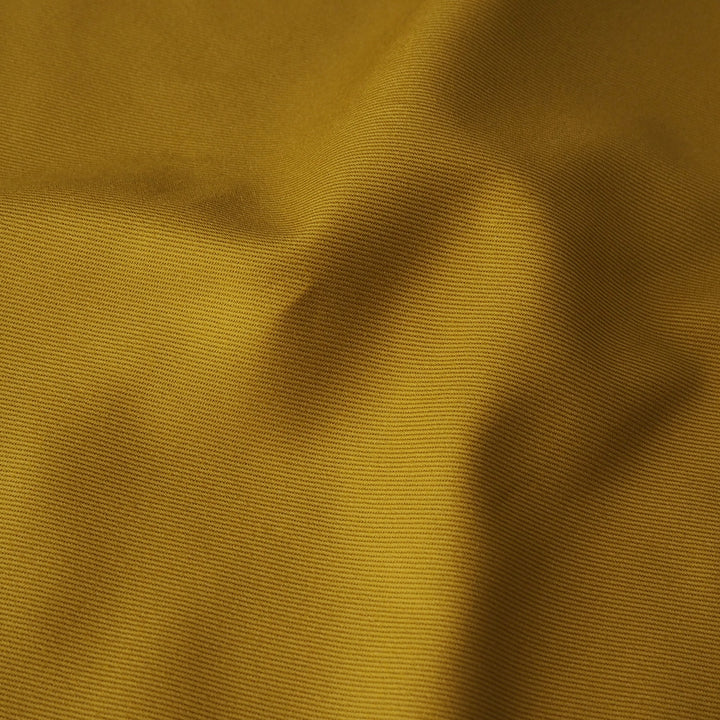 Sevenberry ochre yellow cotton twill drill fabric, perfect for dressmaking and other sewing projects.