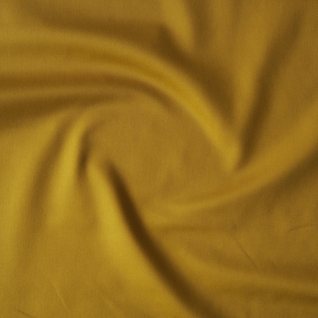 Sevenberry ochre yellow cotton twill drill fabric, perfect for dressmaking and other sewing projects.