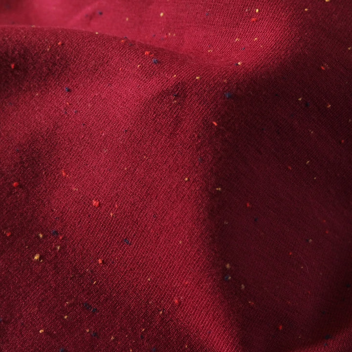 Berry fleeceback sweatshirt fabric with colourful flecks.