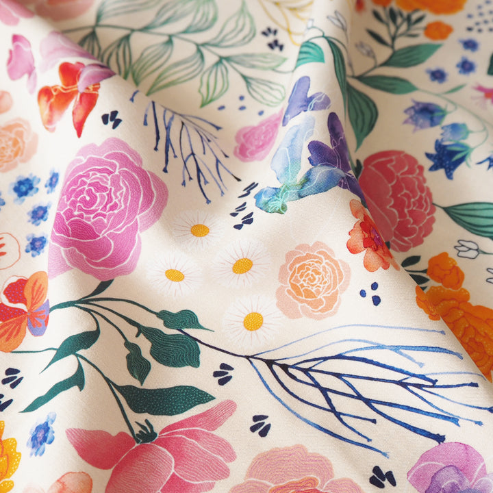 Cream Bee Happy Blooms Ecovero viscose fabric with floral and bee print, exclusive to Guthrie & Ghani.