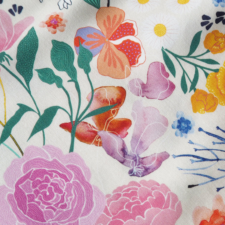 Cream Bee Happy Blooms Ecovero viscose fabric with floral and bee print, exclusive to Guthrie & Ghani.