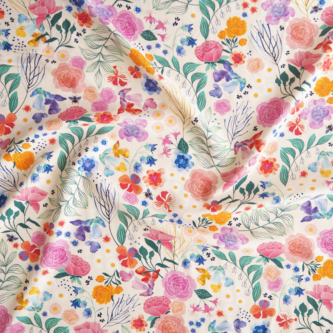 Cream Bee Happy Blooms Ecovero viscose fabric with floral and bee print, exclusive to Guthrie & Ghani.