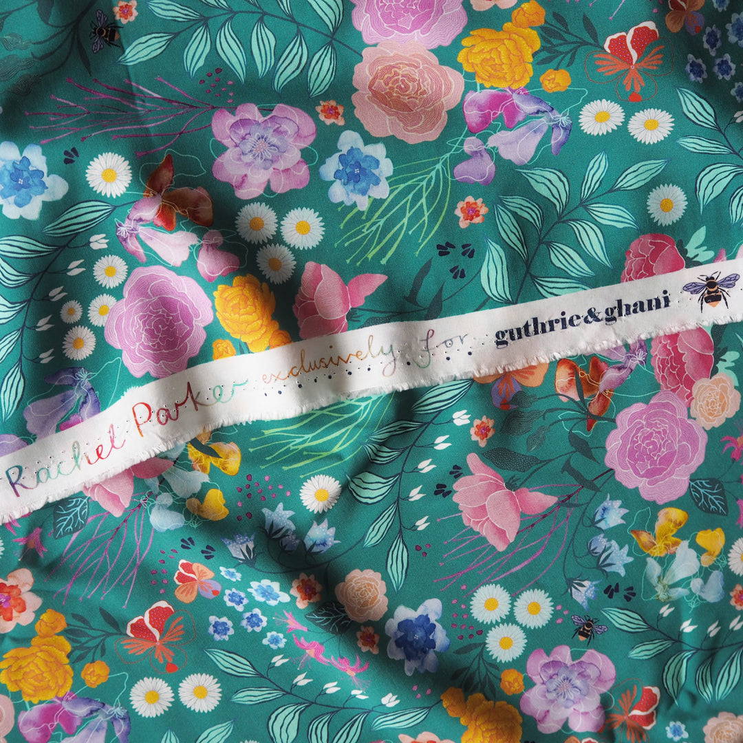 Teal Bee Happy Blooms Ecovero viscose fabric with floral and bee print, exclusive to Guthrie & Ghani.