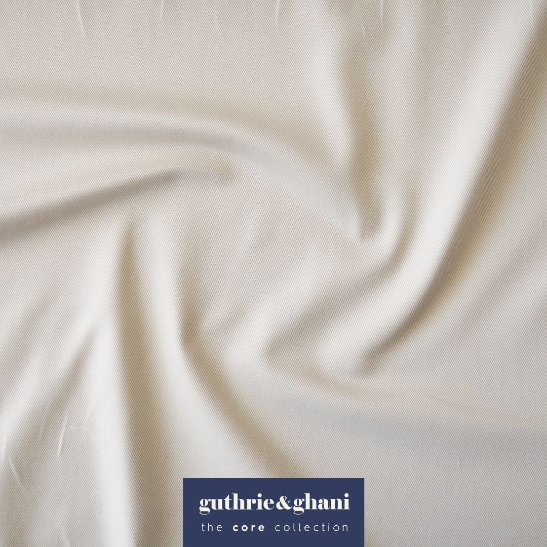 Ecru fabric with 'guthrie & ghani' logo in the corner