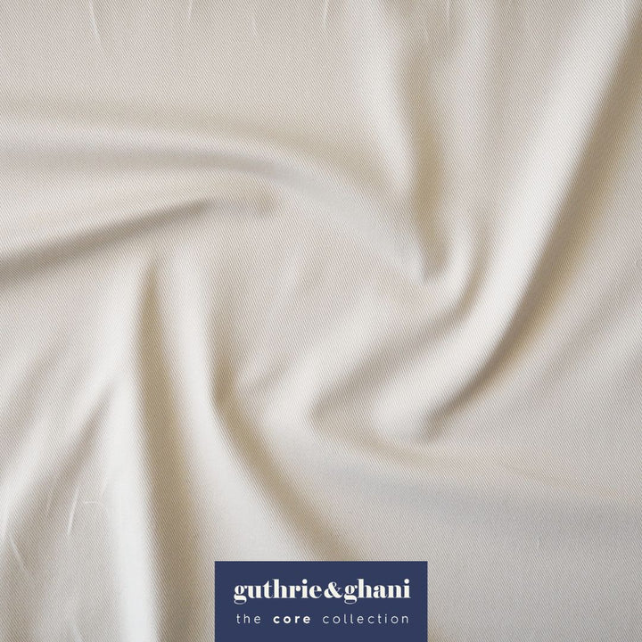 Ecru fabric with 'guthrie & ghani' logo in the corner