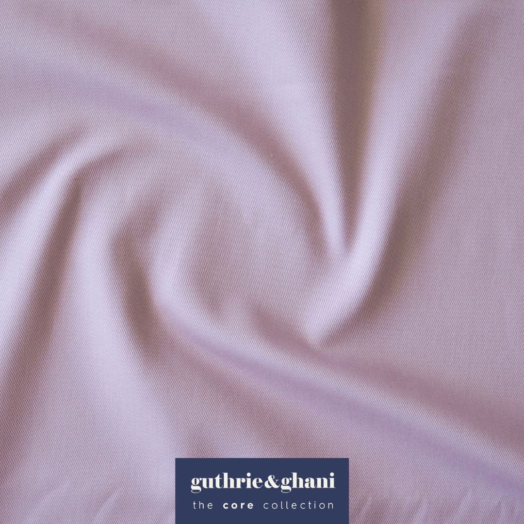 Close-up of lilac fabric with 'guthrie & ghani' label in the corner