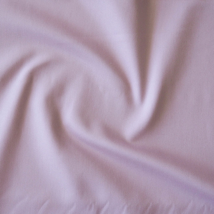 Sevenberry lilac purple cotton twill fabric, showing the texture of the dressmaking fabric
