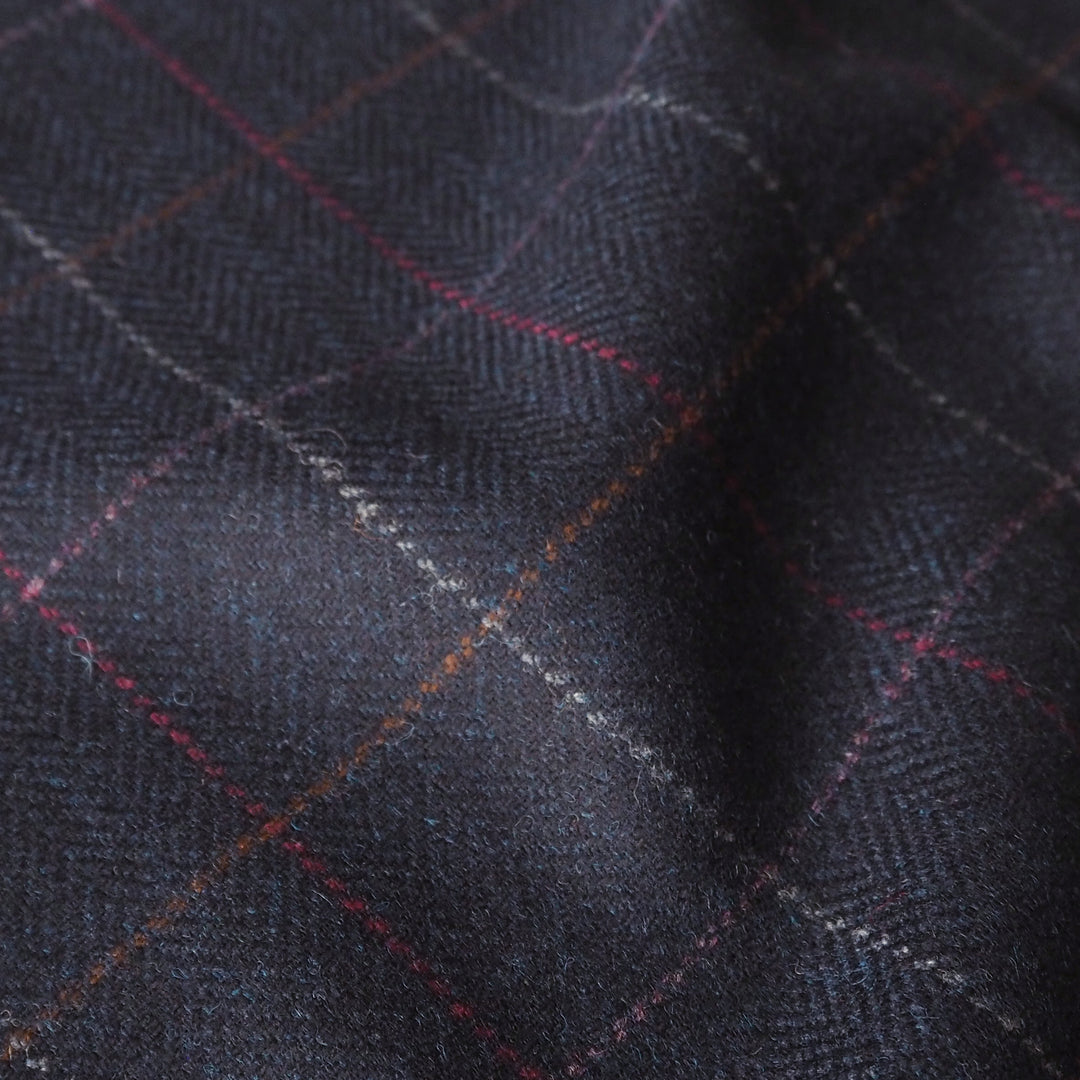 Dark blue british wool fabric with a subtle check pattern