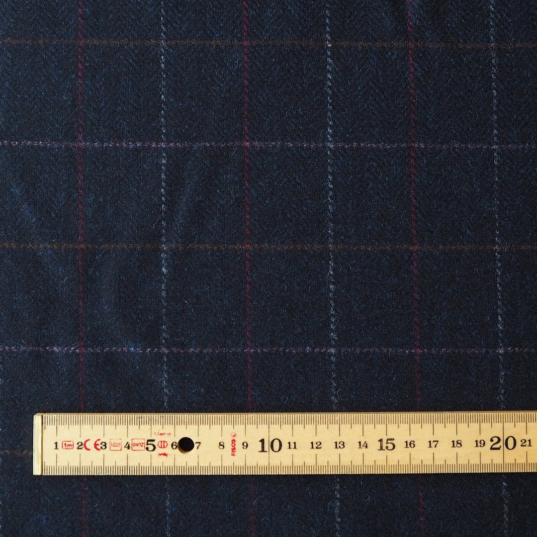 Dark blue british wool fabric with a subtle check pattern