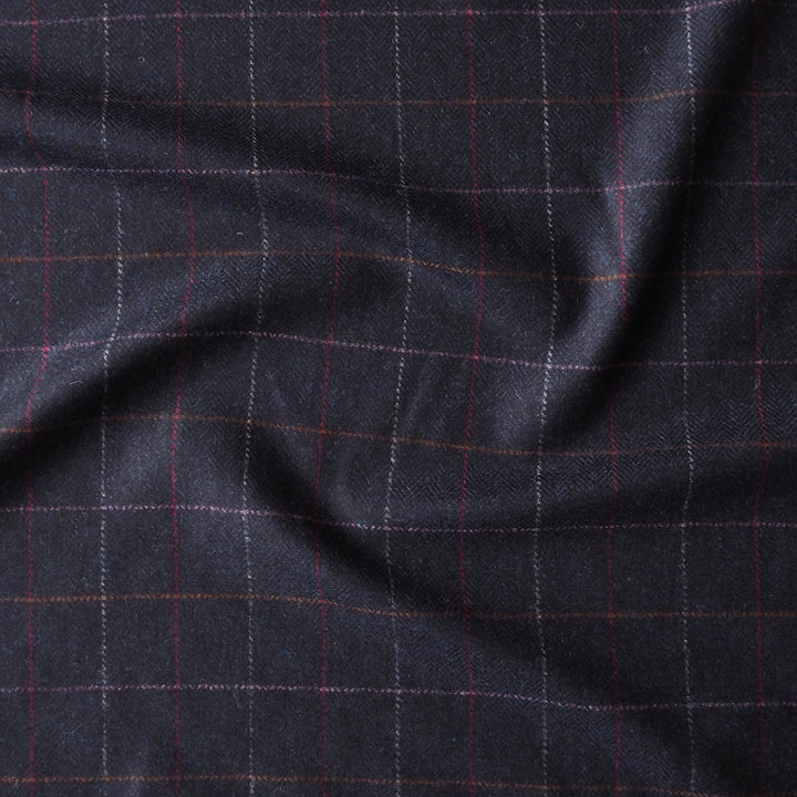 Dark blue british wool fabric with a subtle check pattern