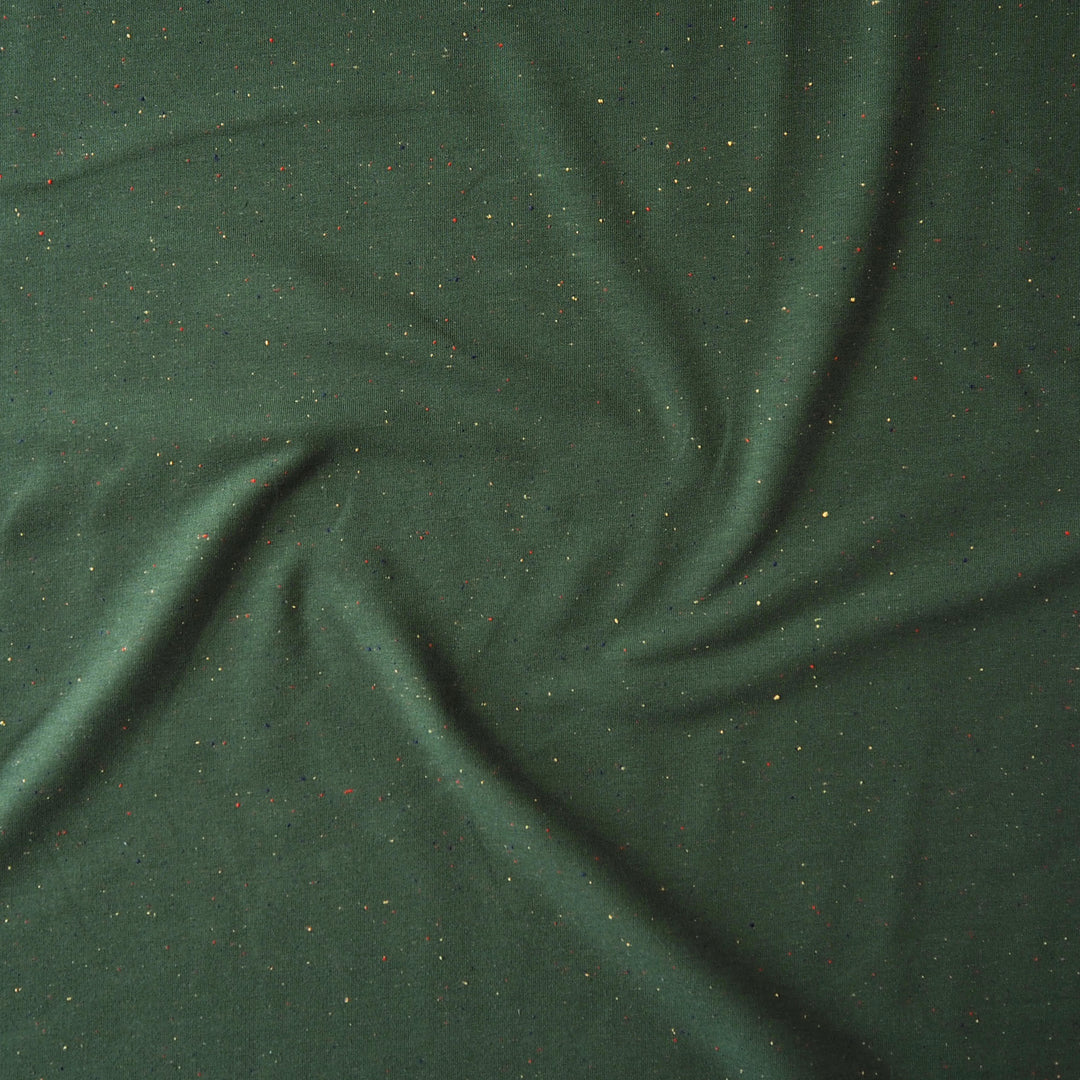 Forest green fleeceback sweatshirt fabric with colourful flecks.