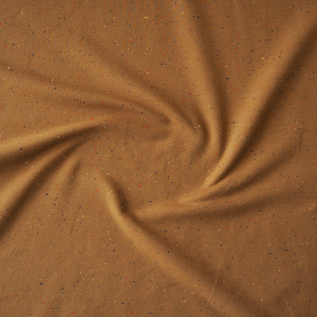 Amber fleeceback sweatshirt fabric with colourful flecks.