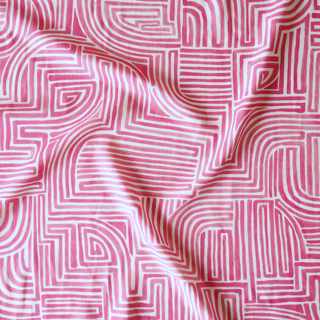 Pink fabric with white geometric pattern