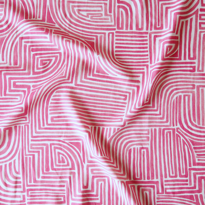 Pink fabric with white geometric pattern