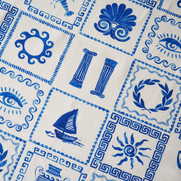 Close-up of blue geometric patterns on a white fabric background
