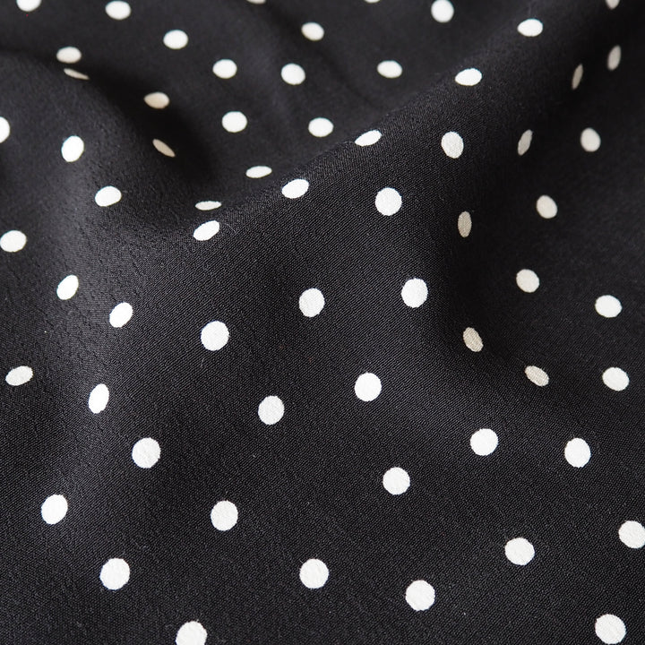Fabric Godmother Black Vivian Polka Dot Viscose Crepe Fabric – black viscose crepe with ivory polka dots