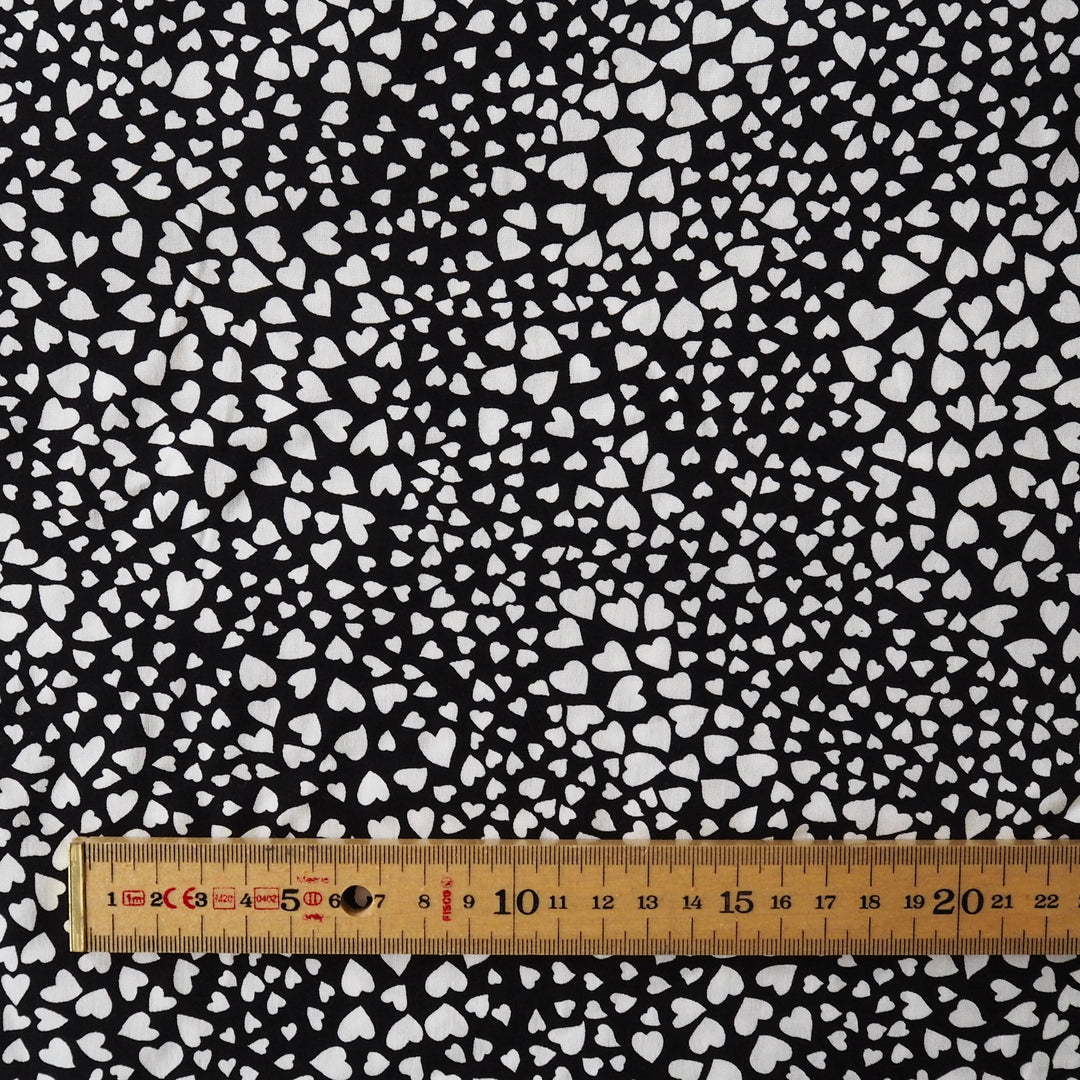 Heart Speckle viscose dressmaking fabric with scattered heart print