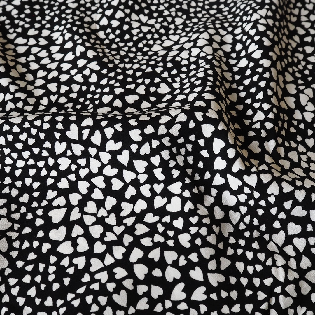 Heart Speckle viscose dressmaking fabric with scattered heart print