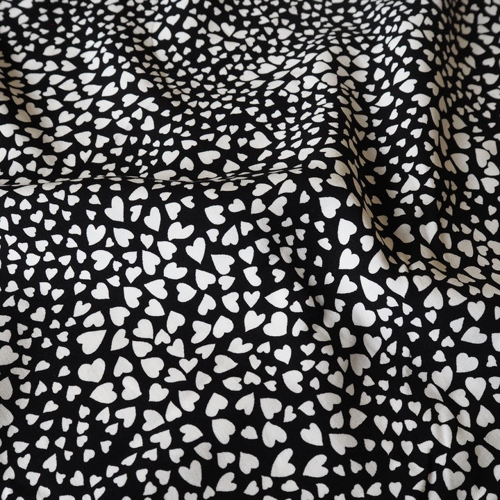Heart Speckle viscose dressmaking fabric with scattered heart print