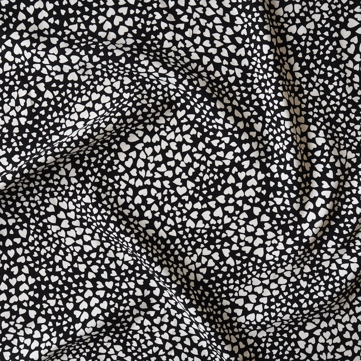 Heart Speckle viscose dressmaking fabric with scattered heart print