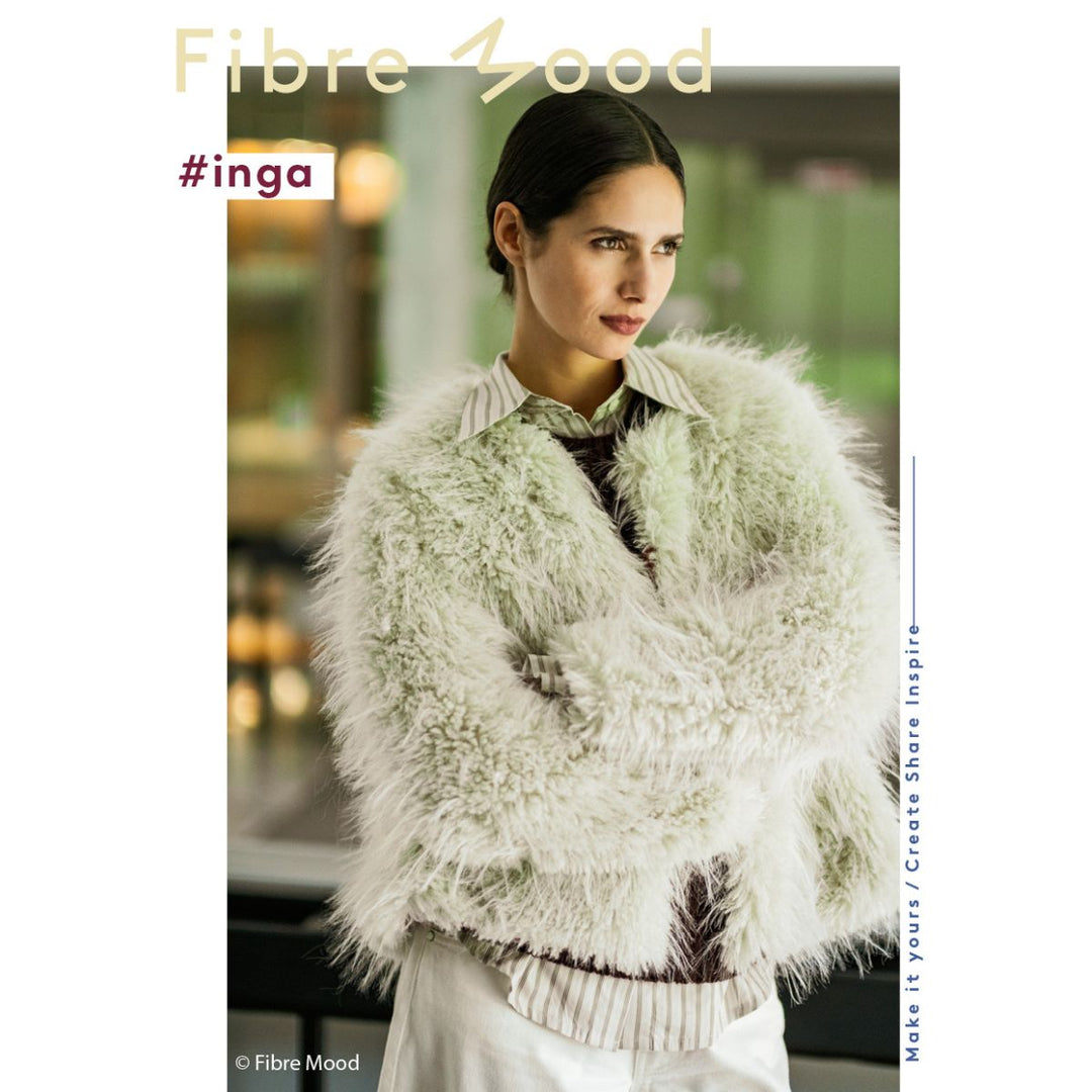 Woman wearing a fluffy white jacket with 'Fibre Mood' branding.