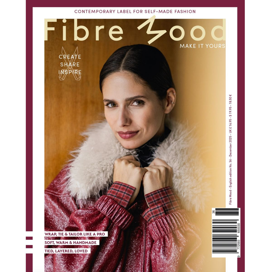 Magazine cover with a woman wearing a red plaid sweater and white fur collar, featuring the brand 'Fibre Mood'.
