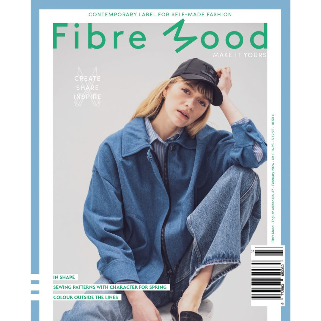 Magazine cover with a person wearing a blue denim jacket and cap, featuring 'Fibre Mood' branding.