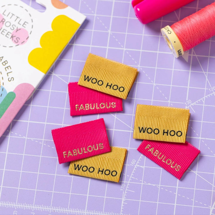 Colorful woven labels with text on a grid surface
