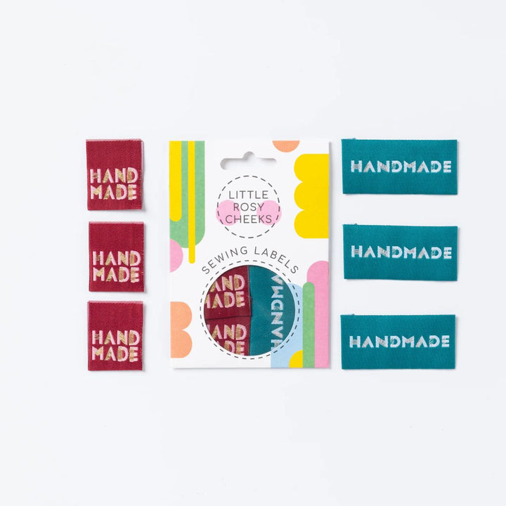 Collection of 'Handmade' labels with packaging on a white background
