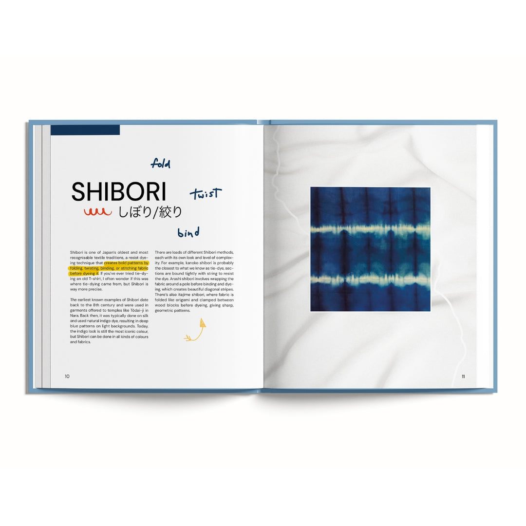 An open book or magazine spread showing a Japanese Shibori tie-dye pattern both in text and as a square color swatch on a white marble-textured page, set against a clean white background.