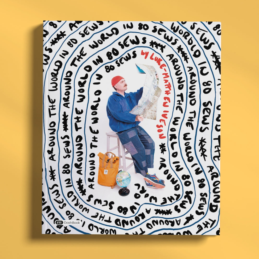 A square art print or poster featuring a stylized illustration of a man sitting on a stool and holding a map, surrounded by concentric circular black text on a white background. The print is displayed against a solid yellow background.