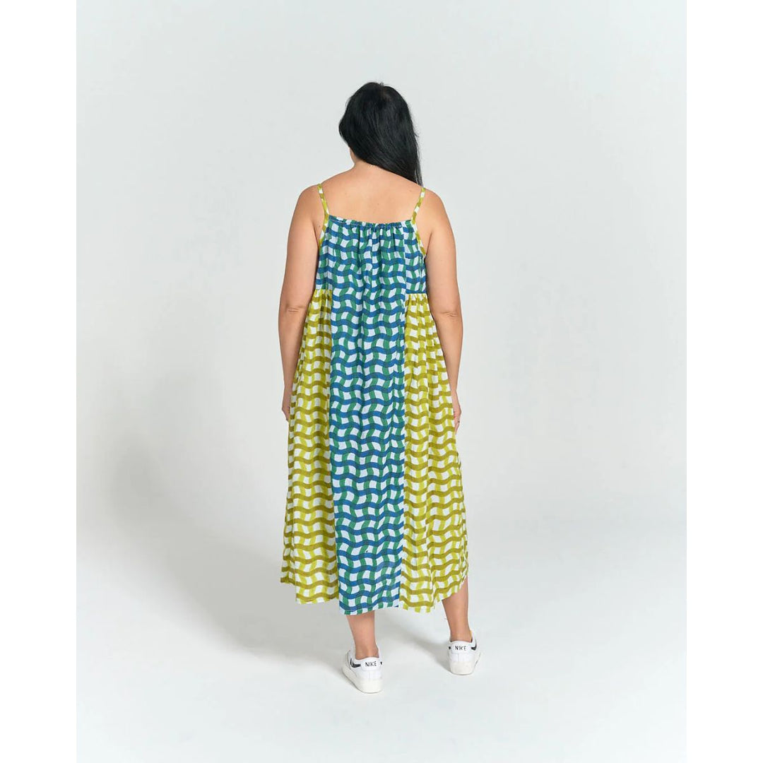 Woman wearing a polka dot dress on a white background