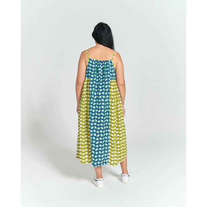 Woman wearing a polka dot dress on a white background