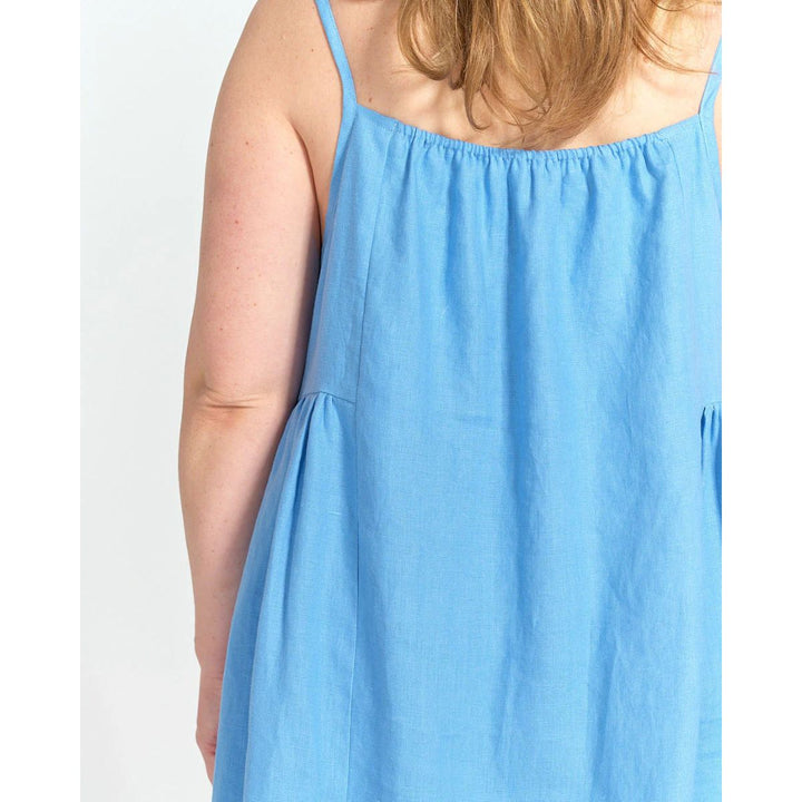 Light blue dress worn by a person on a white background