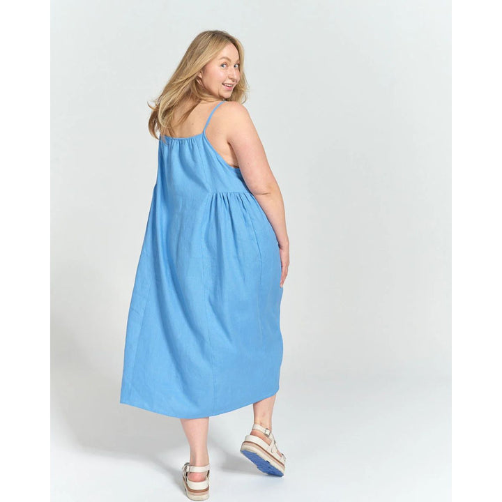 Woman wearing a blue dress on a white background