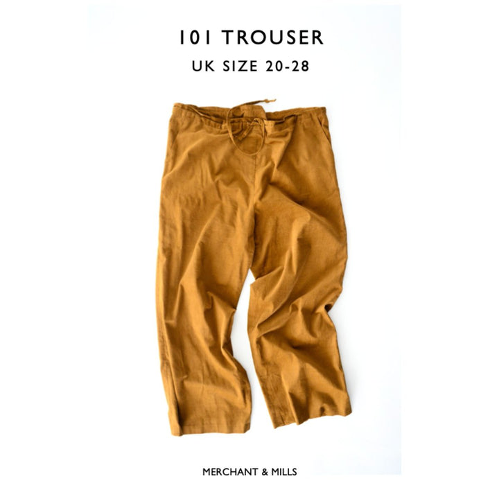 Brown trousers with size and brand information on a white background