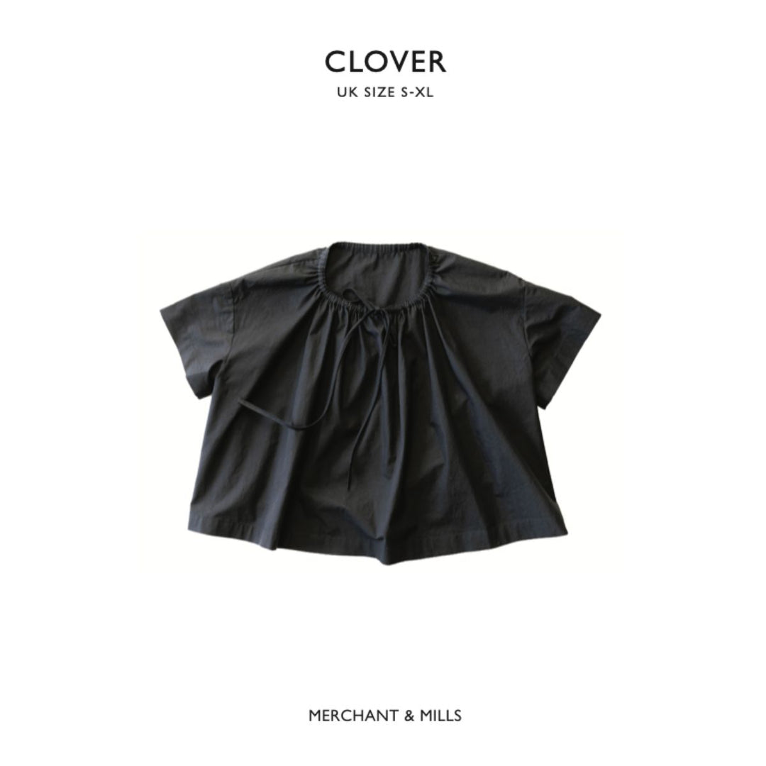 Black blouse with ruffled details on a white background, branded as 'Clover' by 'Merchant & Mills'.