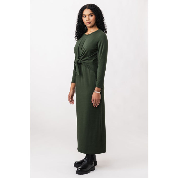 Woman wearing a green dress with a white background