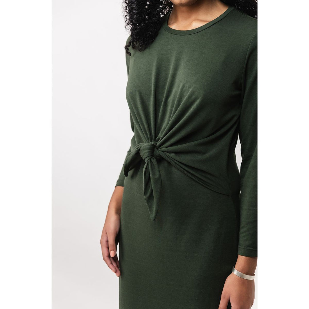 Green dress with a knot detail on a white background