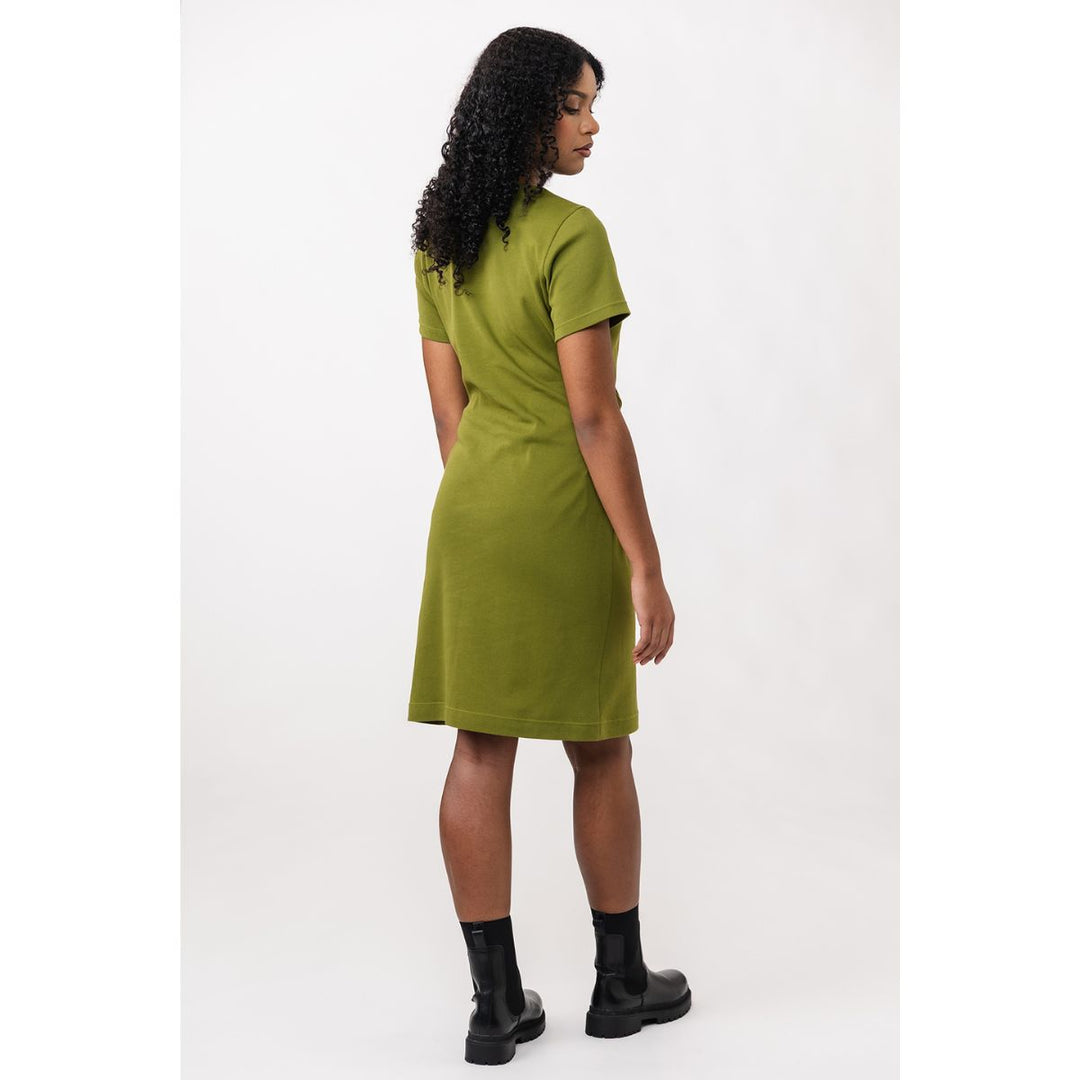 Woman wearing a green dress on a white background