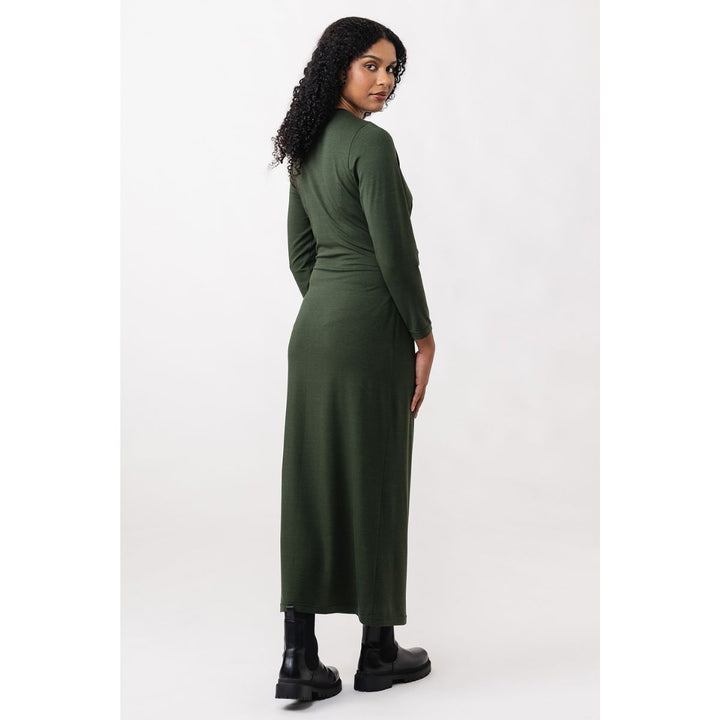 Woman wearing a green dress on a white background