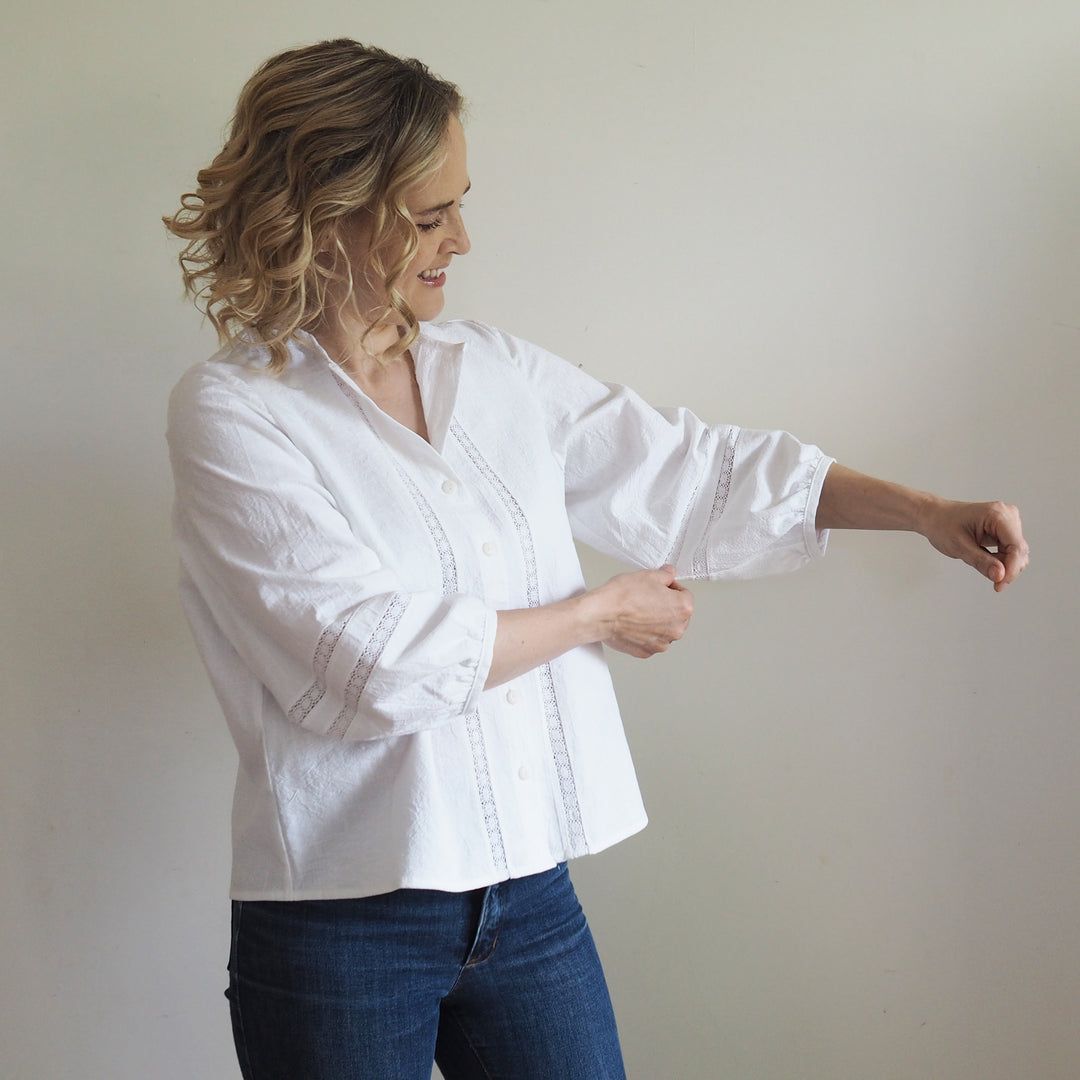 Detail shot of vintage textured cotton with inset lace panel on the Nepheline blouse front and the sleeve 