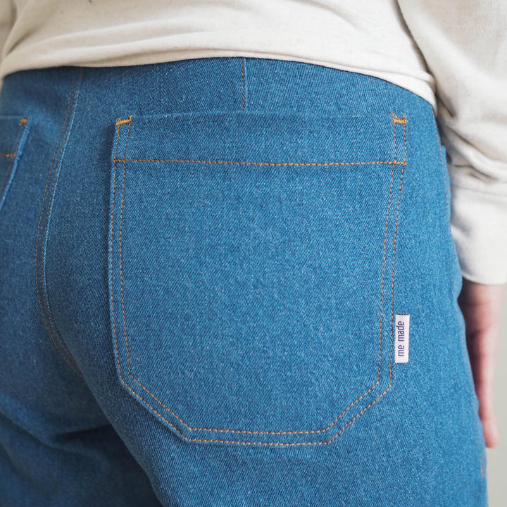 Front view of Oxbow trousers showing topstitched patch pockets with me made label detail